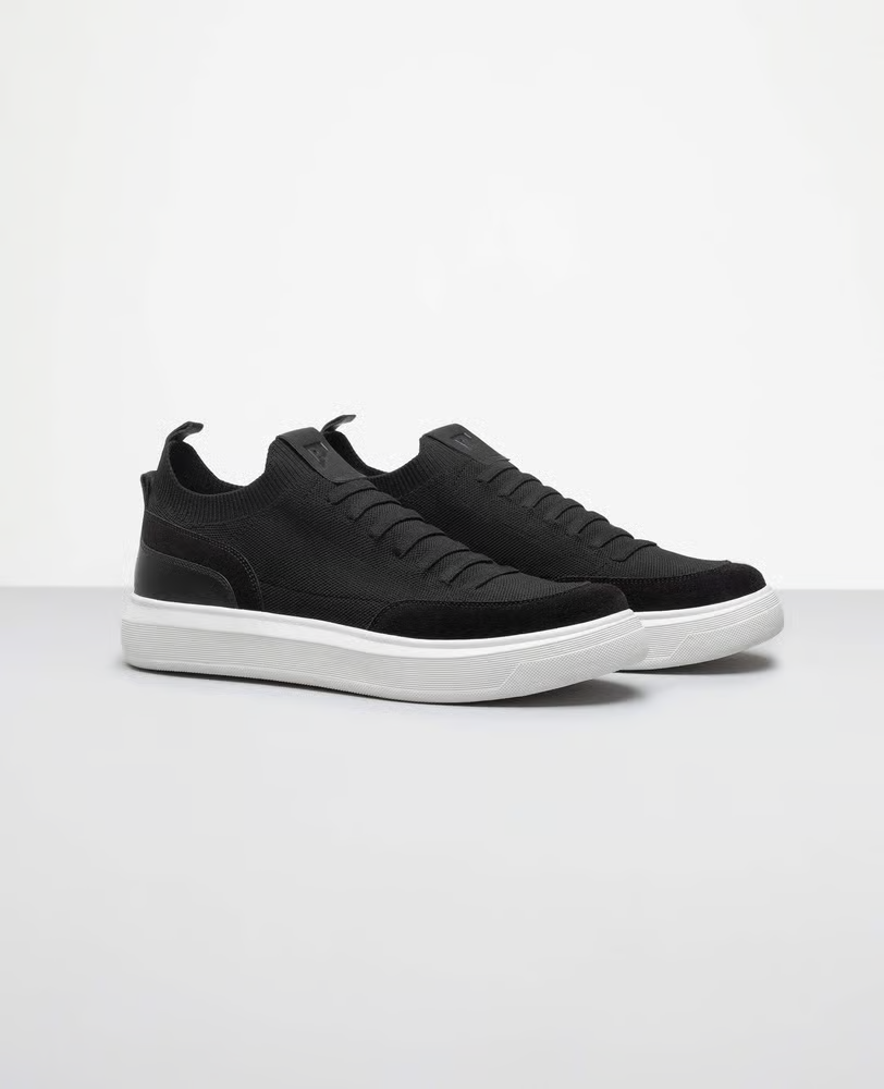 Tênis casual knit preto RS vista lateral externa